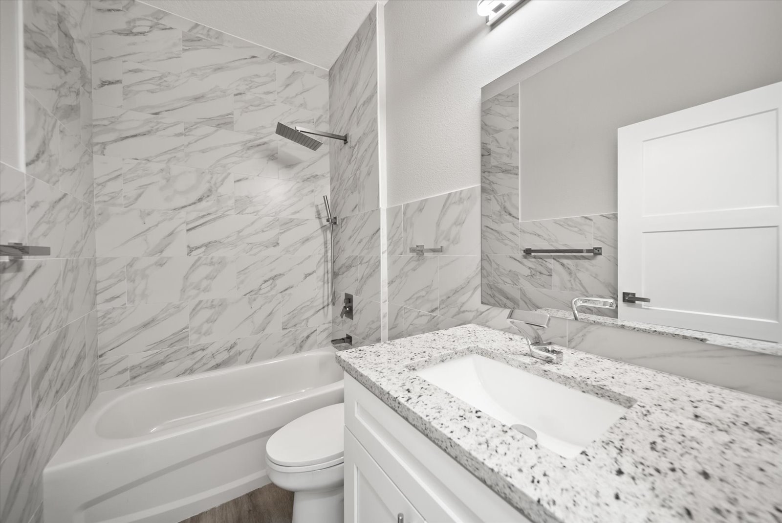 Bathroom with tub and tiled shower