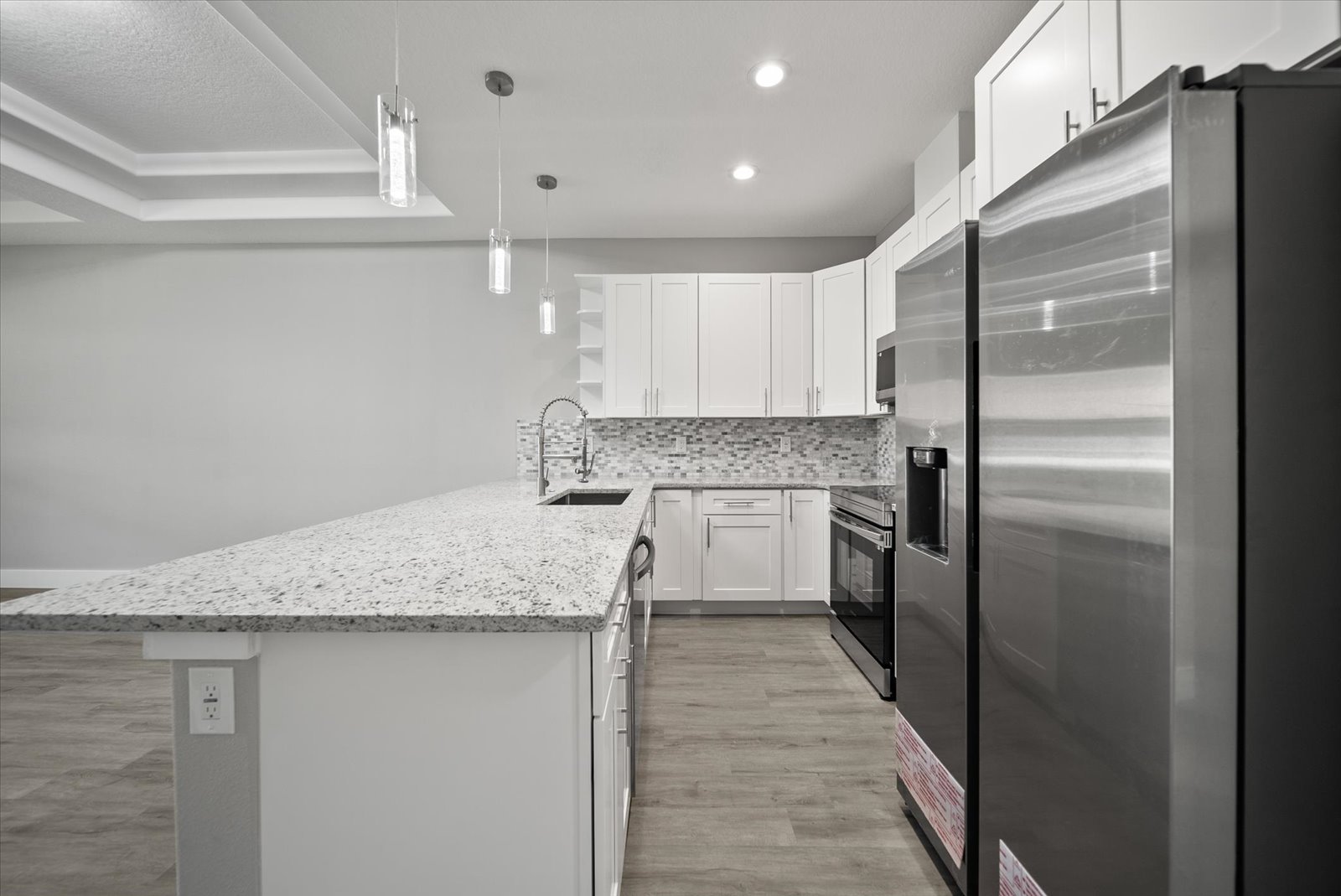 Kitchen with peninsula and stainless appliances