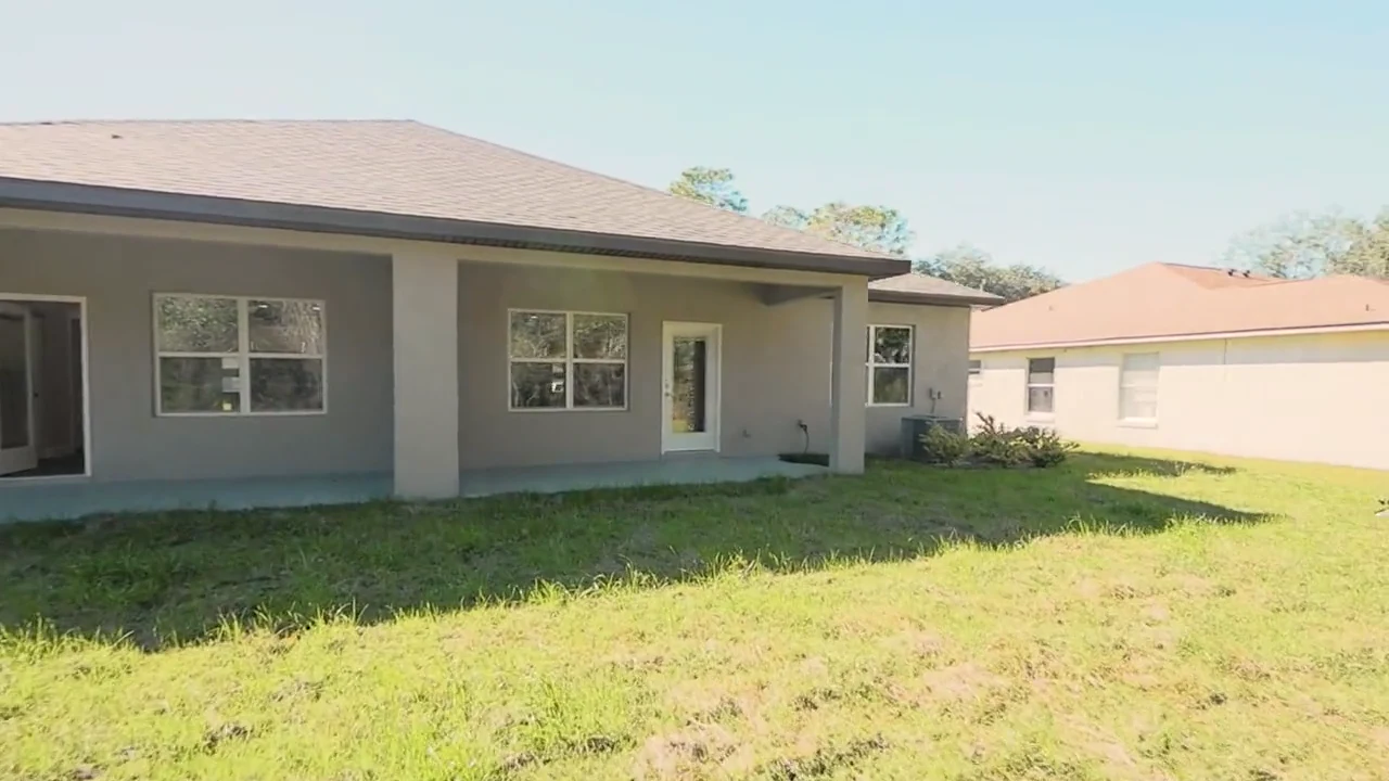 Covered rear patio and exterior of a completed Florida’s Best Builders home