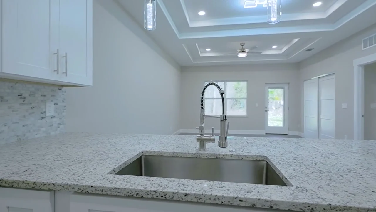Kitchen and living space in a completed Florida’s Best Builders home